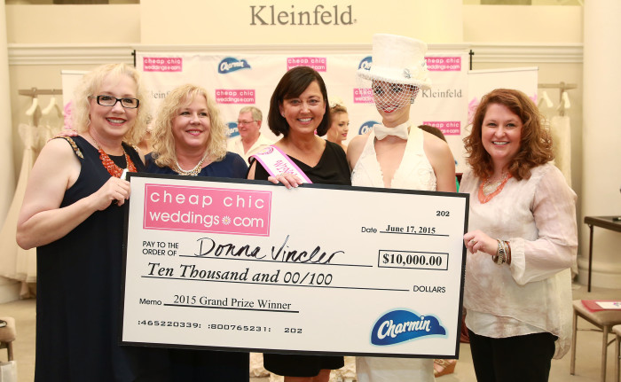 (L-R) Susan Bain and Laura Gawne from Cheap Chic Wedding, the winner of the 11th Annual Toilet Paper Wedding Dress Contest, Donna Pope Vincler, her daughter Aubrey Swander and Velvet Gogol Bennett from Charmin pose with the $10,000 grand prize on behalf of Charmin on Wednesday, June 17, 2015 in New York. Her gown was exclusively made of Charmin toilet paper, glue and thread. (Amy Sussman/AP Images for Charmin)